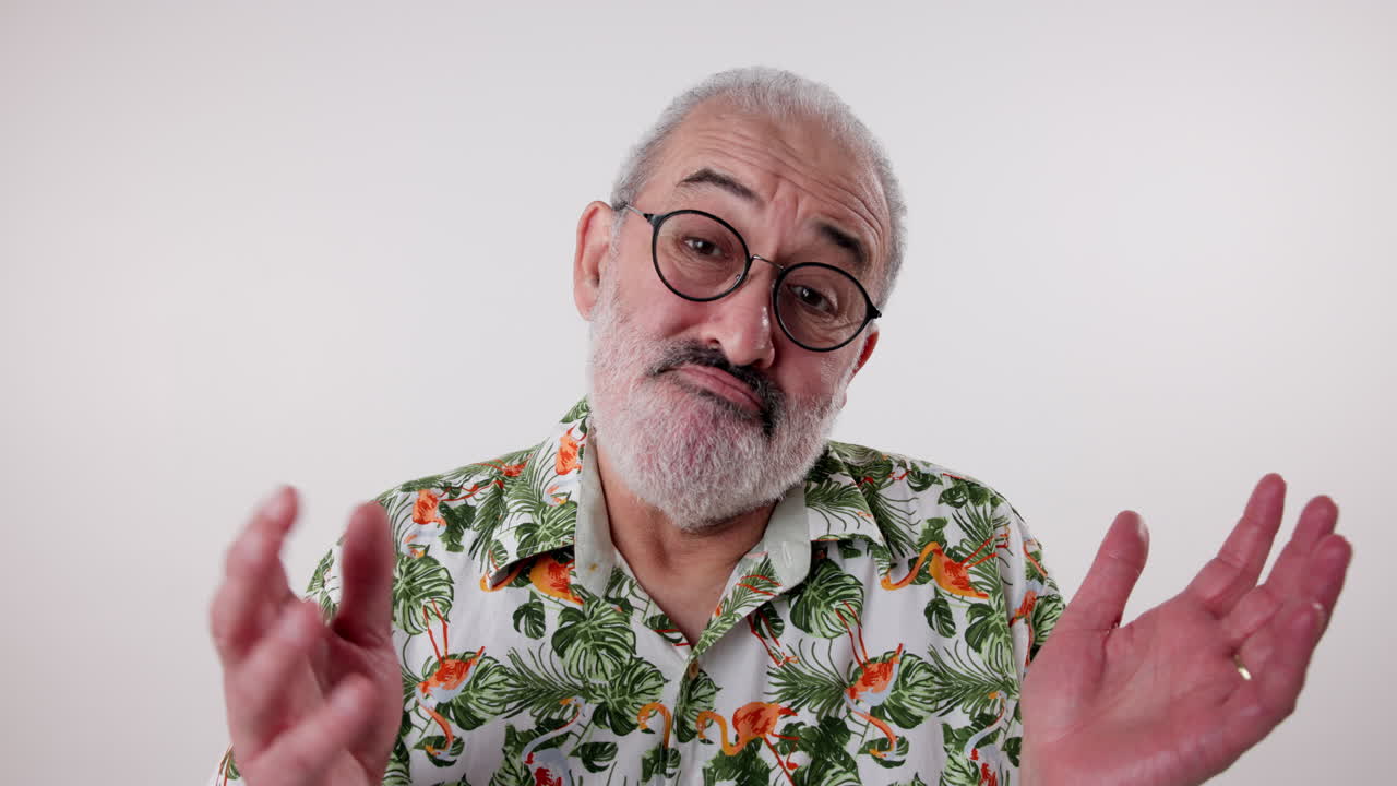 Senior man expressing doubt in Hawaiian shirt