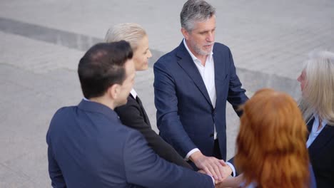 diverse business team stacks hands in a symbol of unity and collaboration