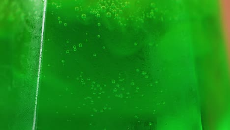 effervescent bubbles in a green beverage