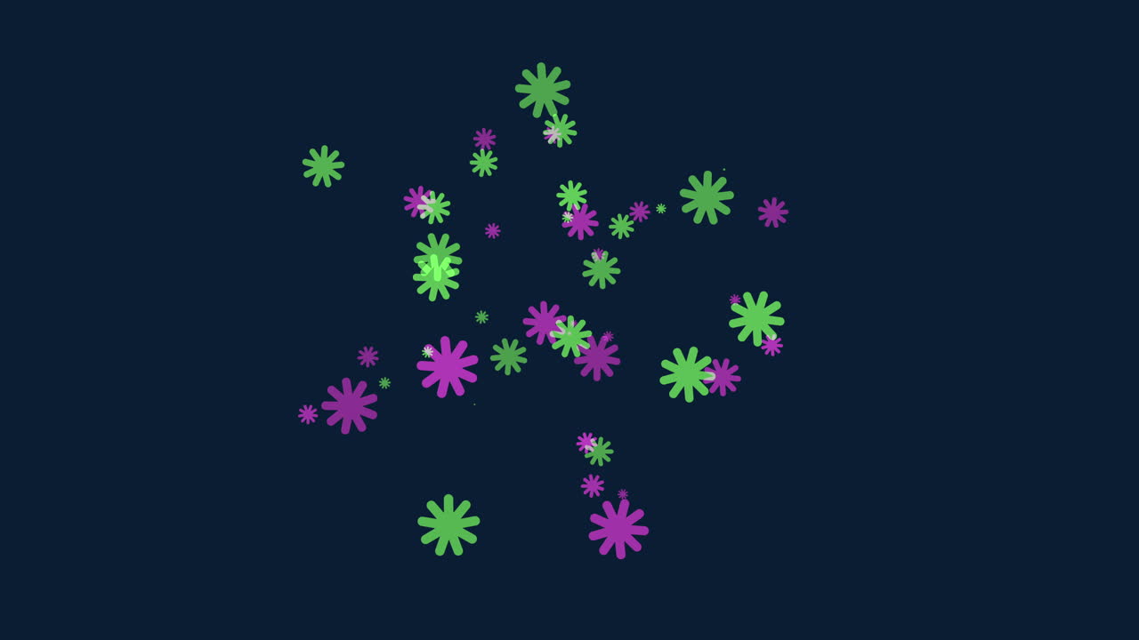 Vibrant purple and green flowers arranged on a black backdrop create a visually striking pattern in the image