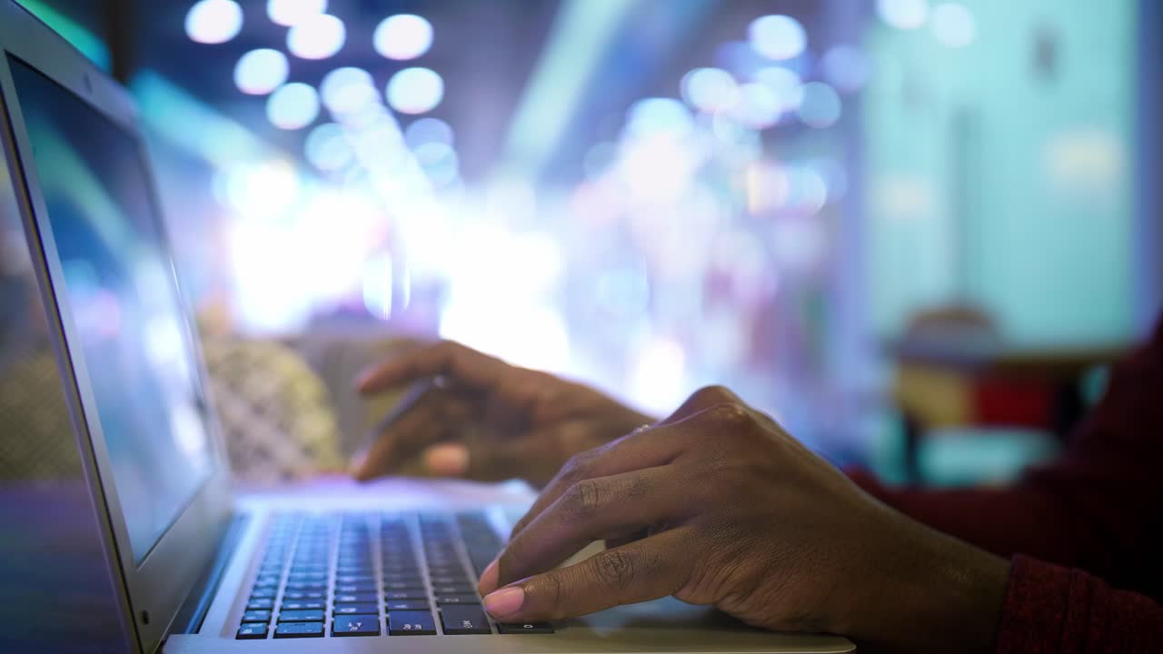 Person working on a laptop in a cafe