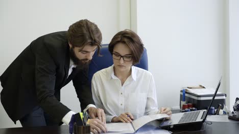 business people reviewing documents in office