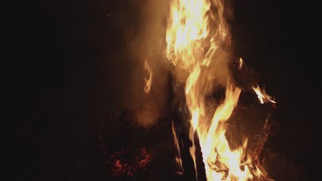 flames burning wooden furniture at night