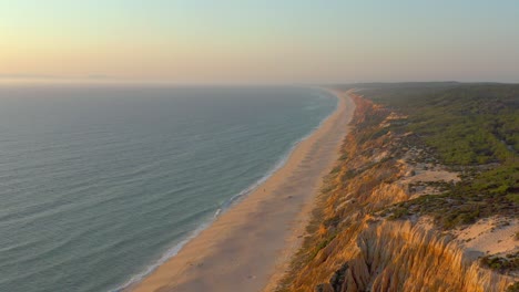 aerial panorama view of arriba fossil da praia da gale fontainhas beach portugal, seaside rock formations canyon erosion