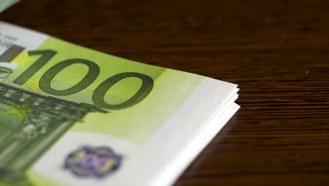 euro banknotes on a wooden table