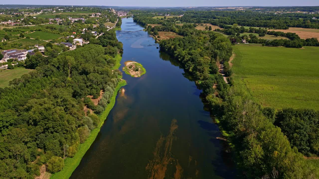 Wide Aerial Approaching Shot of La Vienne River with Chinon City in Background, France