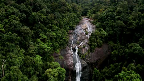 approaching on telaga tujuh waterfall flowing from the rainforest mountains in langkawi, kedah, malaysia