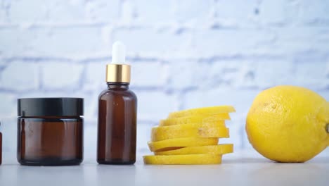 lemon skincare products and fresh lemon slices