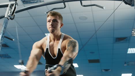 a young man trains in a gym 4