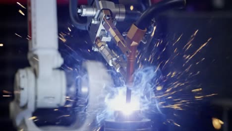 an automated robotic arm with precision tools engaging in a welding process, highlighting the advanced integration of robotics in modern manufacturing techniques