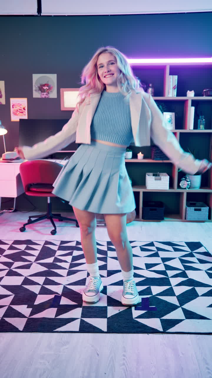Woman Dancing in Room with Neon Lights