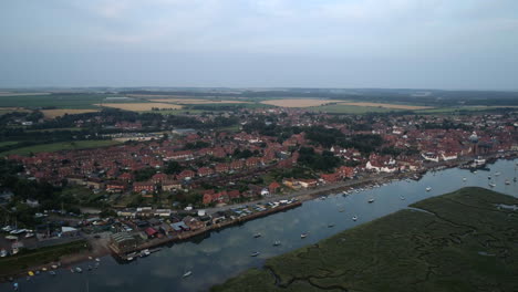 High-Establishing-Drone-Shot-of-Wells-Next-The-Sea-Coastal-Town-at-High-Tide-North-Norfolk-UK-East-Coast