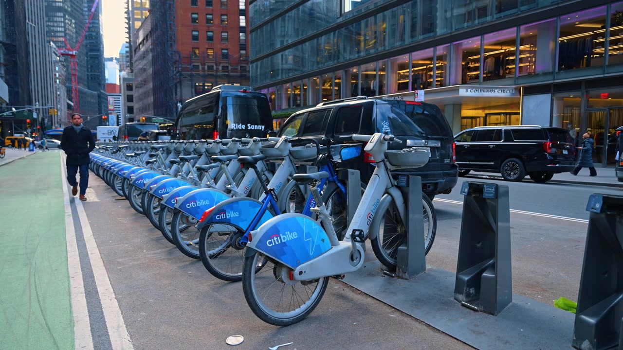 New York, USA, 15 April 2026: Rows of Citi Bike rentals at Columbus Circle New York. Blue shared bicycles docked at a sidewalk station near Columbus Circle in Manhattan