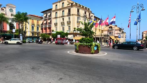 traffic and pedestrians in a vibrant city square