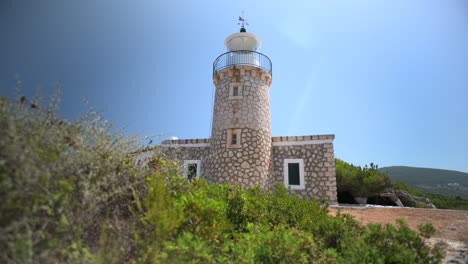 beautiful stone lighthouse on the coast of greece