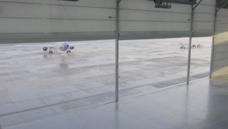 airplane in airport hangar