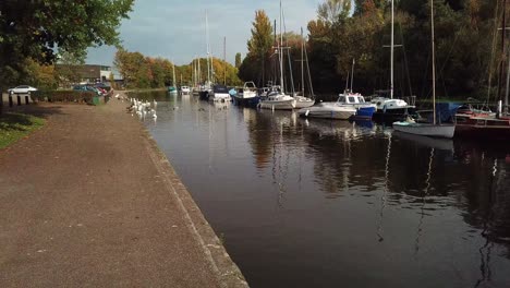 low descending shot of boats on a canal