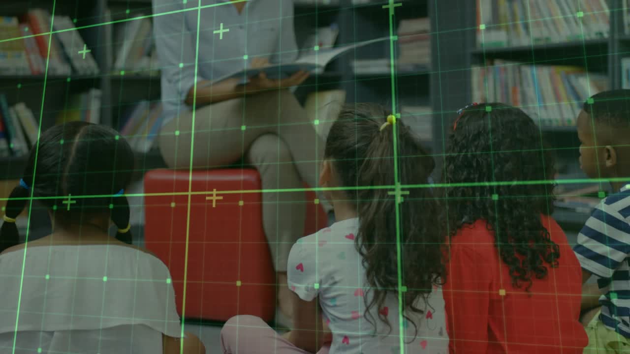 Teacher opening picture book in library, reading and highlighting illustrations to engage children