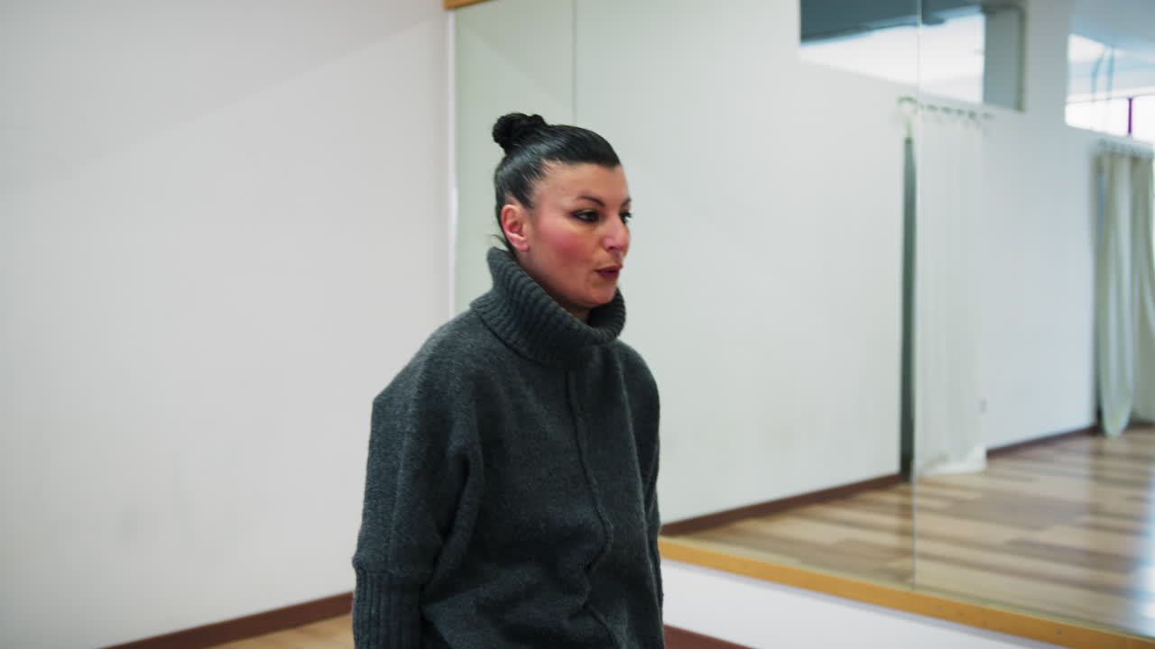 Ballet Teacher Woman Warms Up Her Back In Front Of The Mirror Indoor