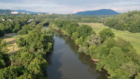 aerial footage of the french broad river at carrier park in asheville, nc