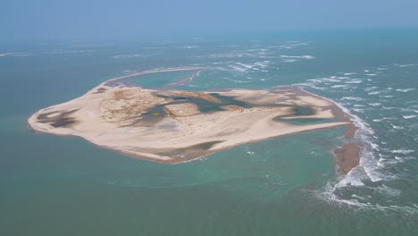 majestic aerial drone shot of dhanushkodi’s last road, where the land fades into the vast ocean.
