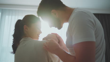 loving parents with newborn baby