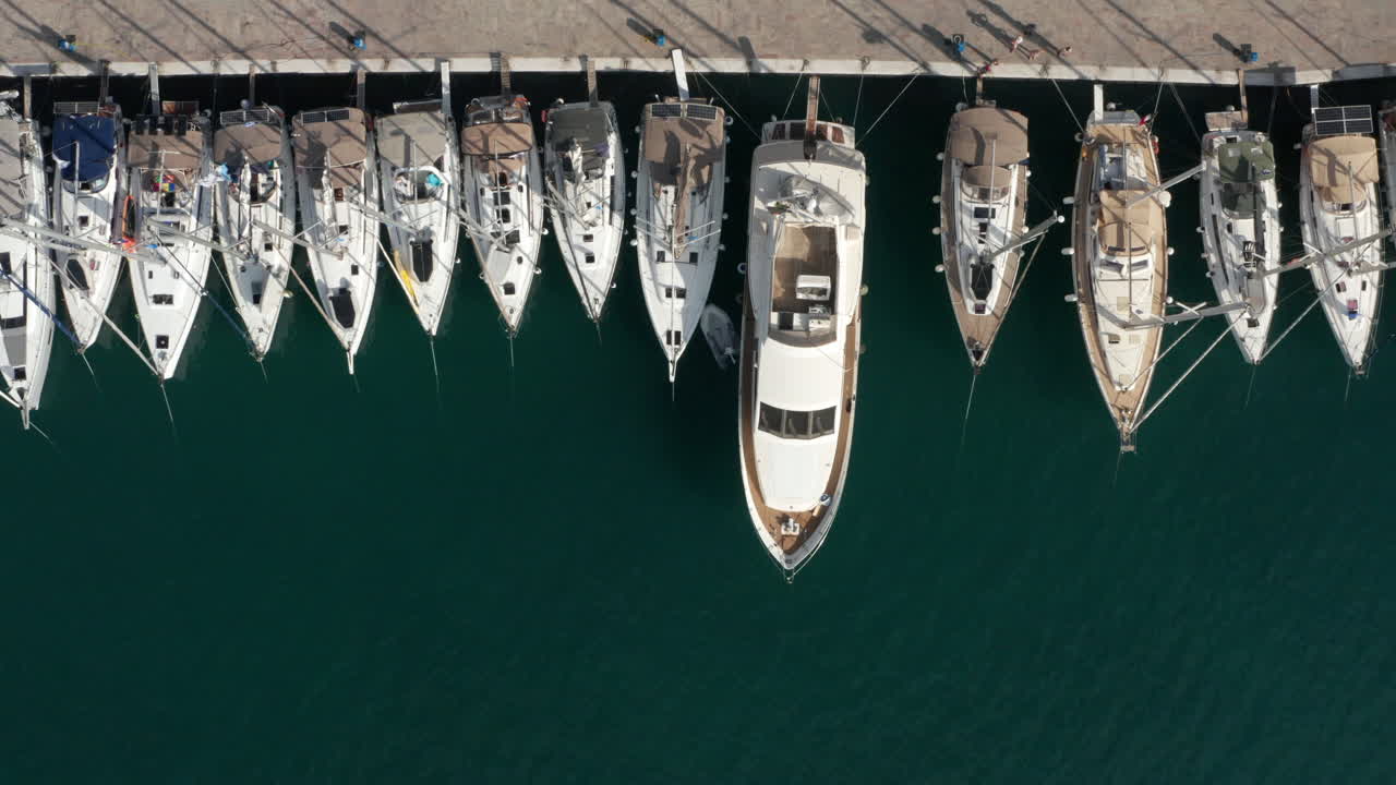 Yachts Parked In Pier Of Poros Island In Greece - aerial shot