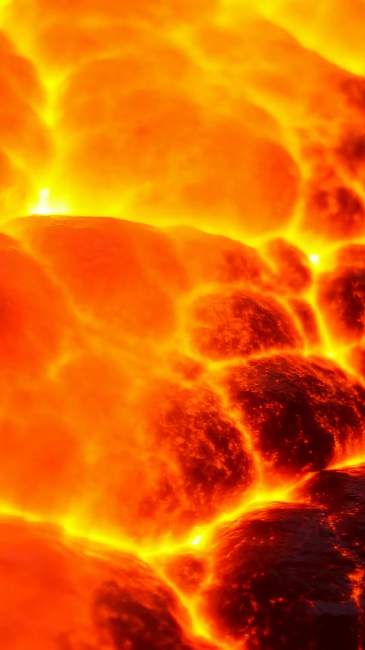 Video verticale: La telecamera si sposta mostrando la superficie di un lago di lava che si raffredda, formando croste e fessure incandescenti.