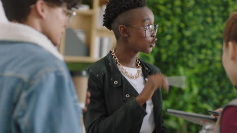 young-group-of-business-people-meeting-african-american-team-leader-woman-using-digital-tablet-computer-sharing-ideas-showing-training-project-on-screen-in-multi-ethnic-office