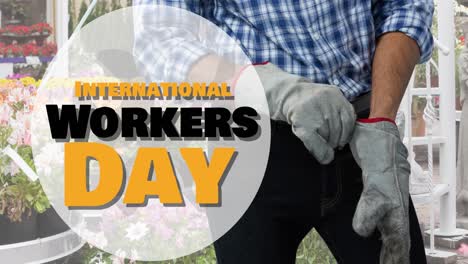 animation des internationalen arbeitstagstextes über kaukasischen männlichen arbeiter im garten