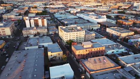 aerial view of a sprawling urban cityscape at golden hour