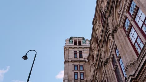 detailed stone facade of a historic building with arched windows in vienna, austria