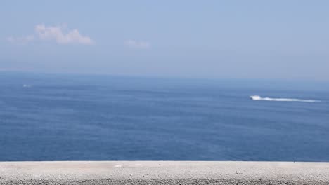 a boat moves across the sea