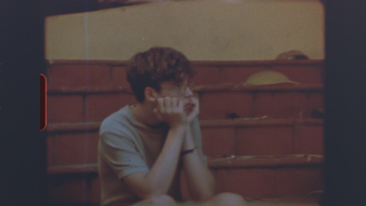 A Young Man in a Pensive Mood on Vintage Film