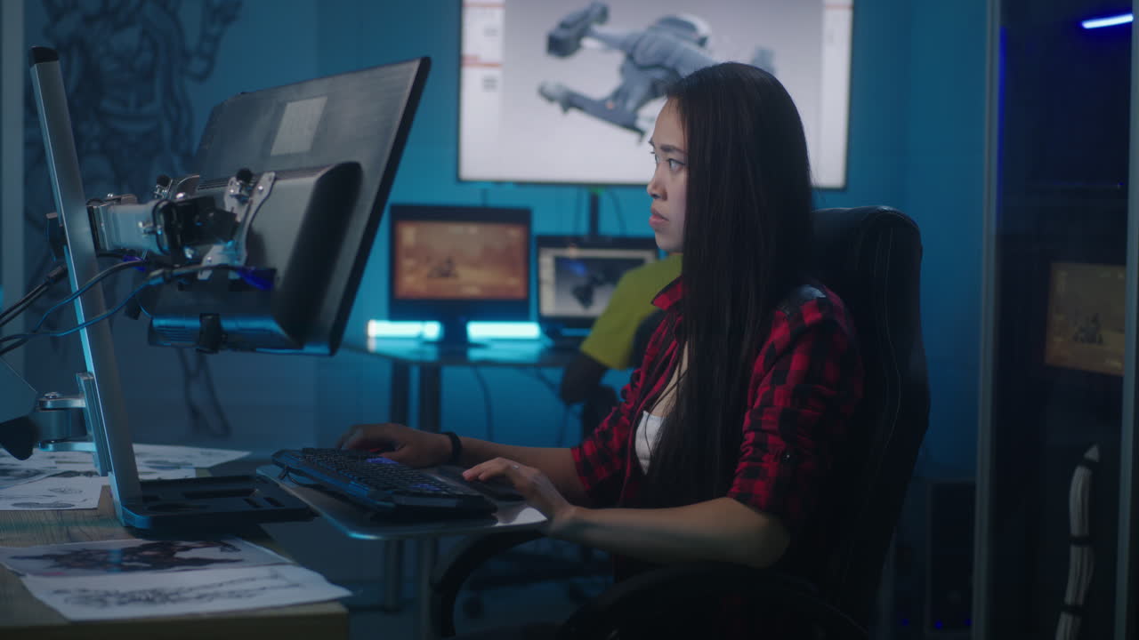 Young Woman Working on Computer in a Design Studio