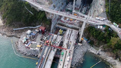 Hong-Kong-cross-bay-link-construction-project,-a-dual-two-lane-bridge-connecting-Tseung-Kwan-O-Lam-Tin-Tunnel-to-Wan-Po-Road,-Aerial-view