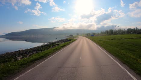 vehicle point-of-view driving a car on a road in norway