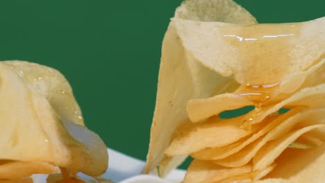 turning a pile of potato chips on rolling down honey