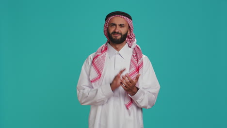 adult in traditional attire clapping