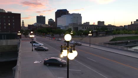 street lights on bridge in des moines, iowa at dusk