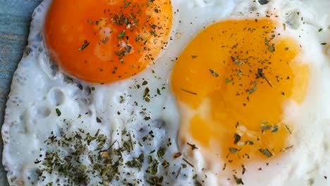 fried eggs in the plate close up ,,