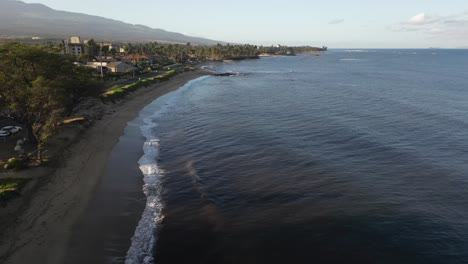 sand beach shore, traffic on coastal highway in kihei, maui, hawaii