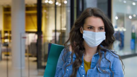 Video-of-young-woman-in-shopping-mall-during-pandemic