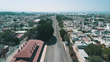 backwards view of train rails near queretaro station in mexico