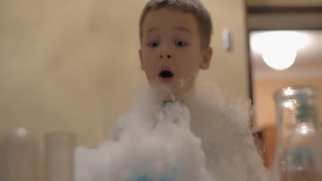 boy having fun with liquid nitrogen white smoke