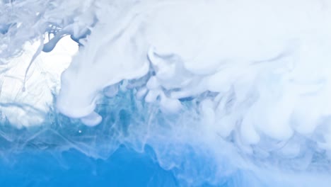 white and blue ink in water