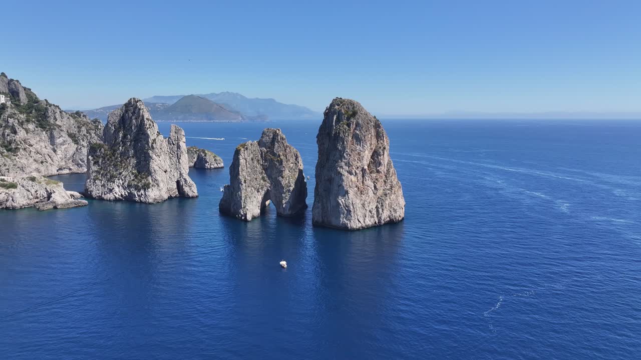 Faraglioni Of Capri At Naples In Campania Italy. Coastal Landscape. Waterfront Scene. Faraglioni Of Capri At Naples In Campania Italy. Beach Scenery. Paradisiac Seafront. Capri Island Skyline.