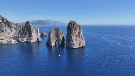faraglioni of capri at naples in campania italy. coastal landscape. waterfront scene. faraglioni of capri at naples in campania italy. beach scenery. paradisiac seafront. capri island skyline.