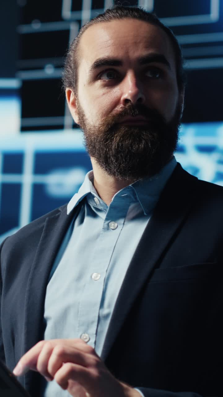 Vertical Video Tech savvy administrator reviewing AI brain programming on a tablet