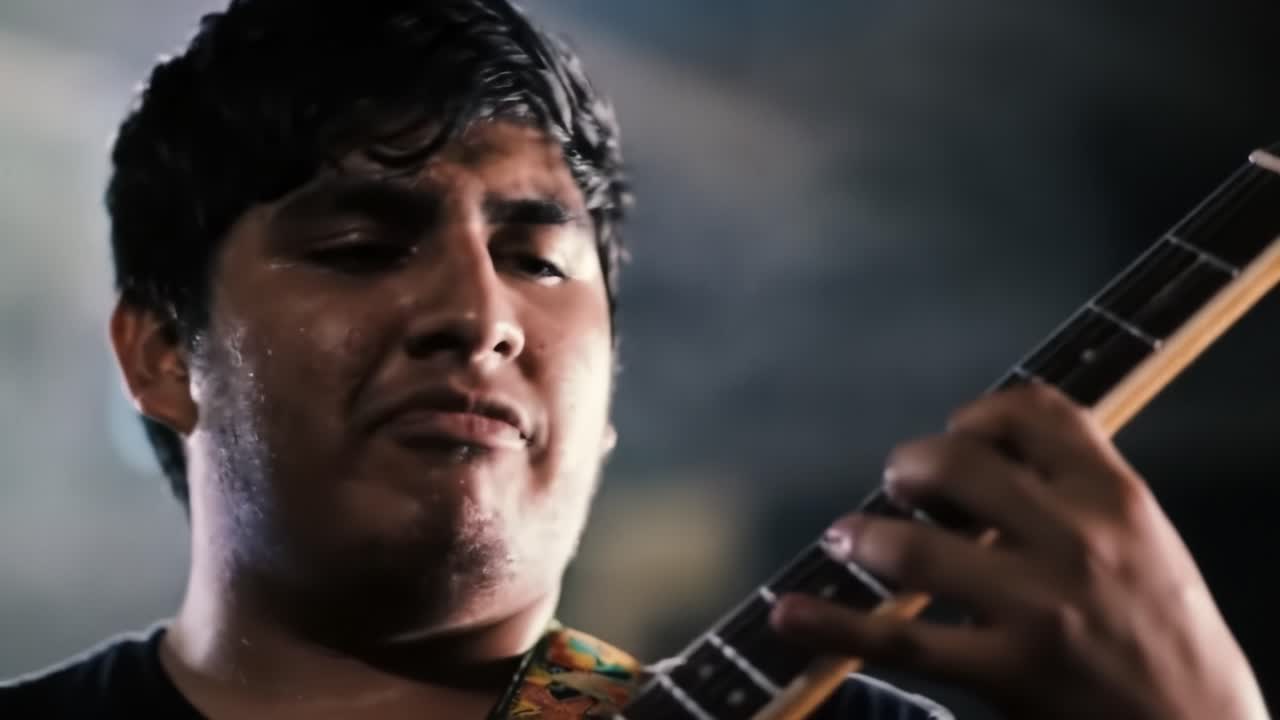 Intense Guitar Performance: A Passionate Musician Embraces the Emotional Depth of His Craft in a Powerful Showcase of Talent and Connection to the Audience